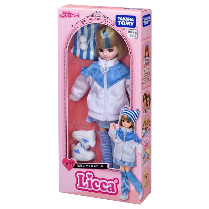 Licca doll in a pink box, wearing a white and blue tracksuit with matching hat and shoes.