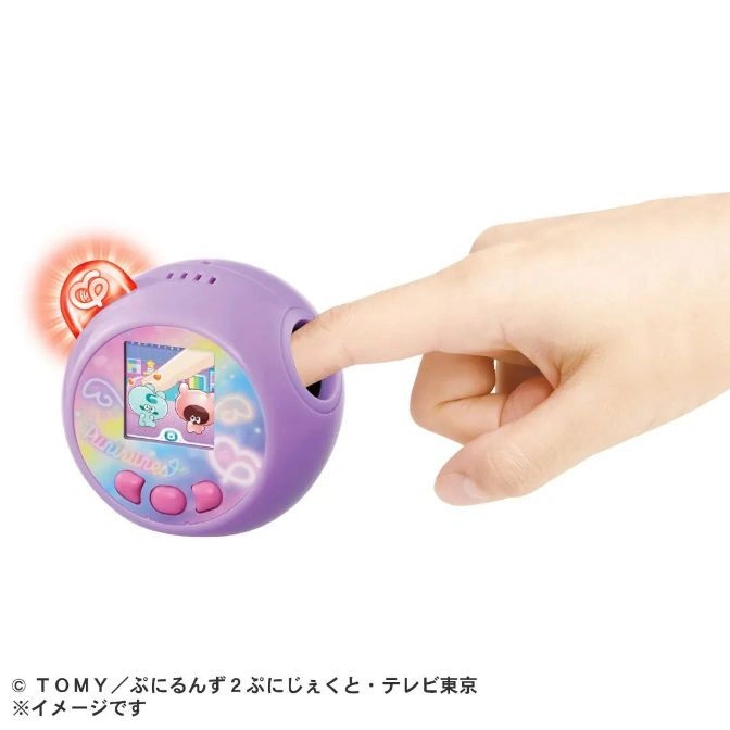  Purple toy with screen showing characters, finger touching sensor, and glowing heart.