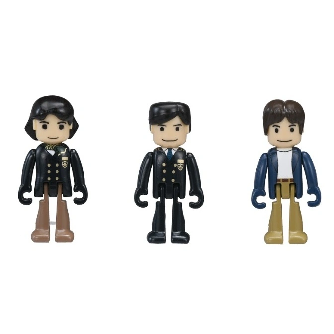  Three toy figures: two in school uniforms and one in a jacket and casual clothes.