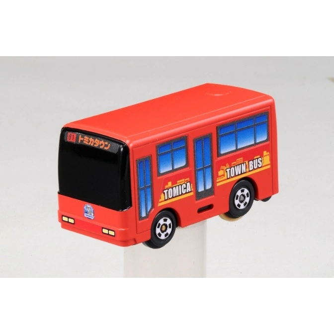  Red Tomica Town Bus toy with 'TOWN BUS' and 'TOMICA' graphics.
