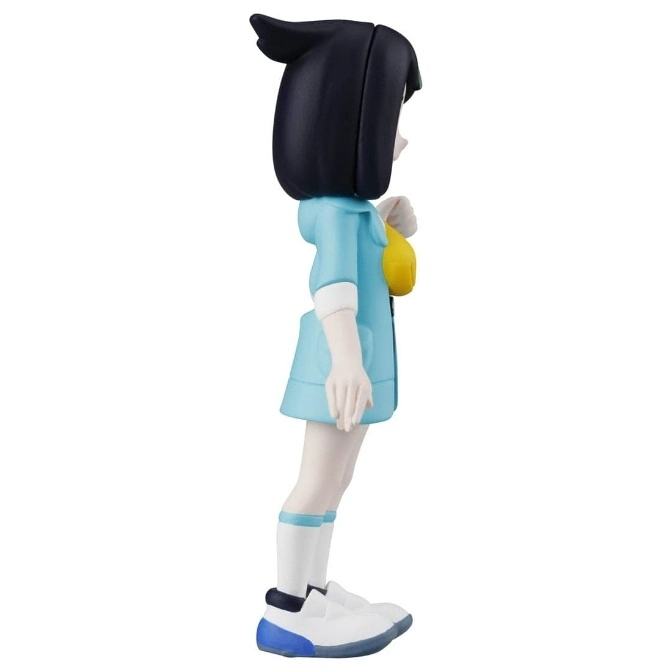  Side view of a Lillie Pokémon figure in a blue jacket, white socks, and blue and white shoes.