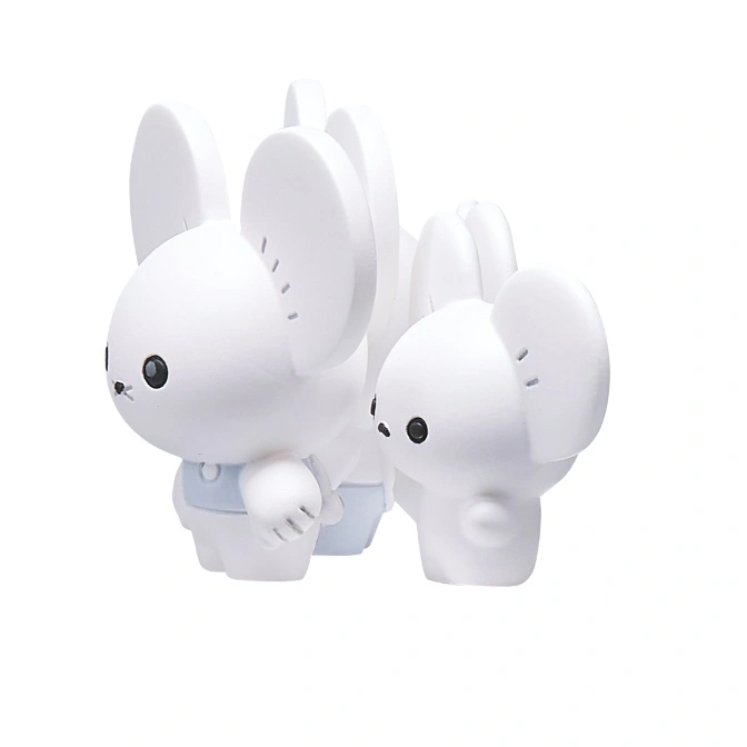  Two white mouse-shaped toys, one wearing overalls, standing next to each other.