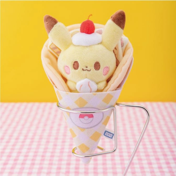  Pikachu plush toy in a crepe cone with a cherry on top, displayed in a metal holder.