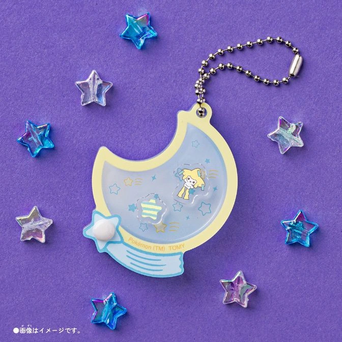  Crescent moon Pokémon keychain with star accents on a purple background.