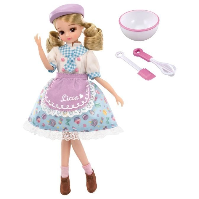 Licca doll in baker outfit with bowl, spatula, and whisk.