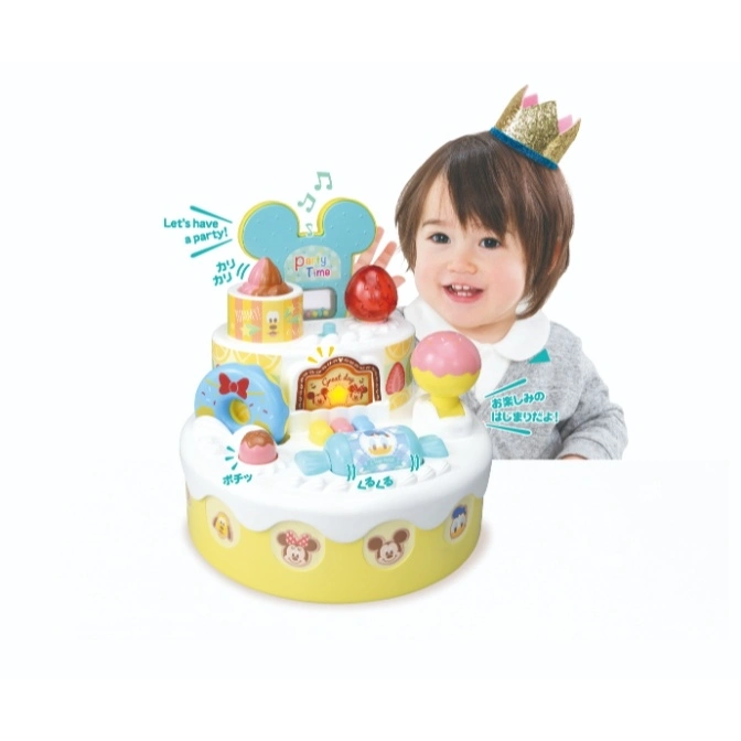  Disney cake toy with Mickey Mouse ears, treats, and a child wearing a crown.