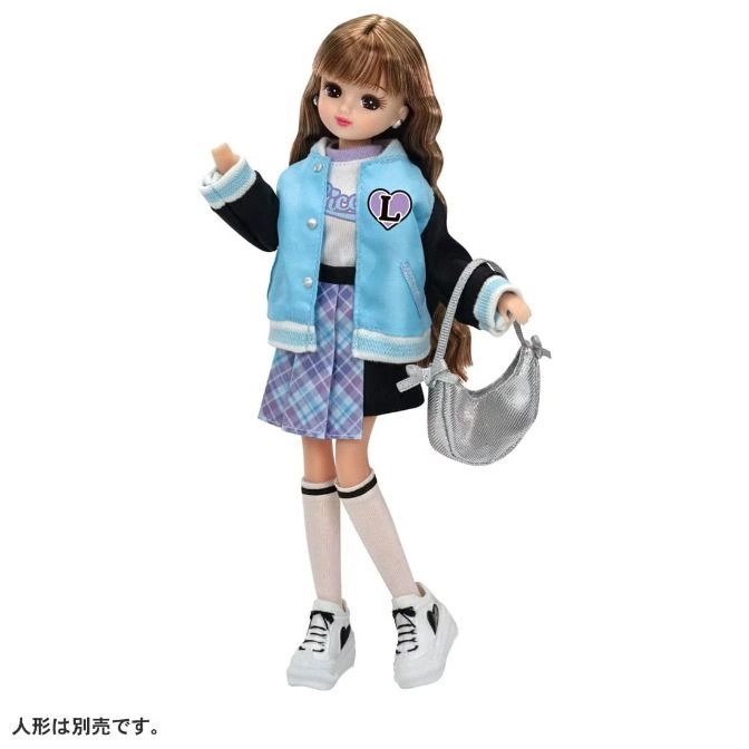 Licca-chan doll in varsity jacket, skirt, sneakers, and silver purse.
