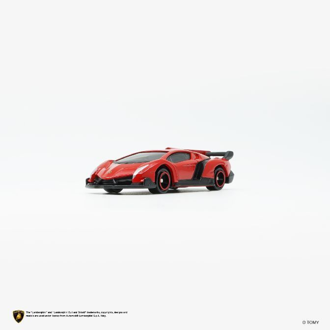  Red toy Lamborghini Veneno with black accents and spoiler on a white background.