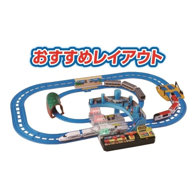  Toy train set with blue tracks, trains, tunnel, station, and control panel.