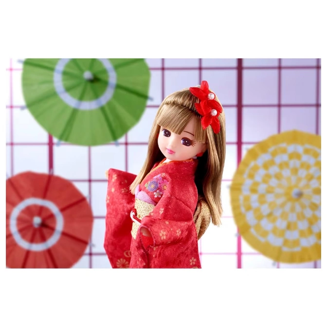 Doll in red kimono with flower hair clip, surrounded by paper umbrellas.