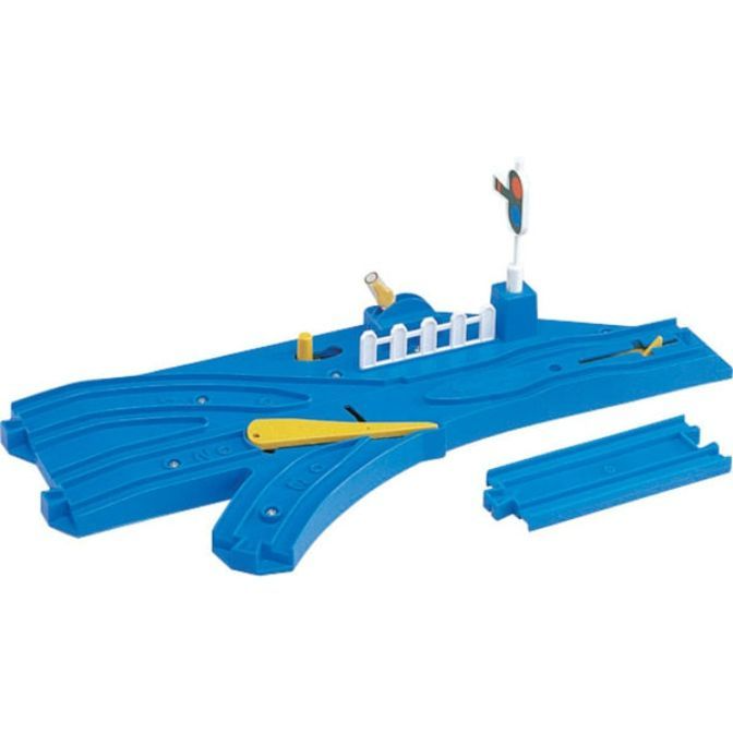 A blue plastic toy train track with a switch and a signal.