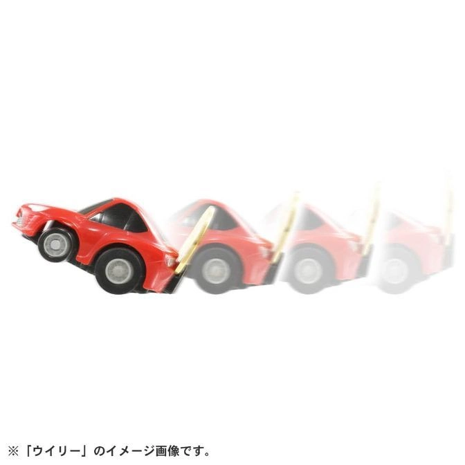  Red toy car doing a wheelie, shown in motion blur.