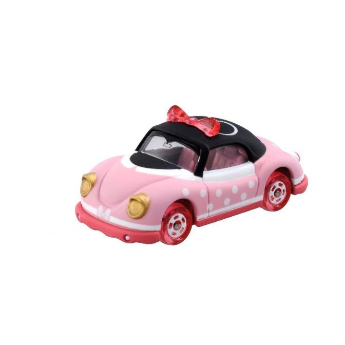 Pink Minnie Mouse toy car with white polka dots and a red bow.