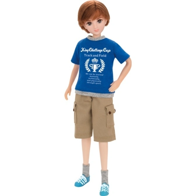 Boy doll in a blue t-shirt, khaki shorts, socks, and sneakers, standing on a white background.