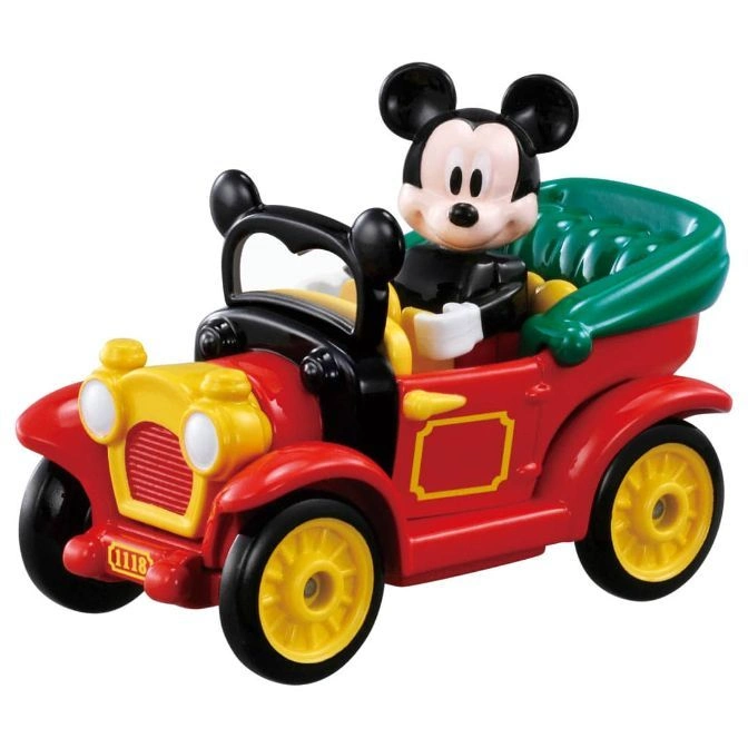 Mickey Mouse in a red and yellow vintage toy car with green seat.