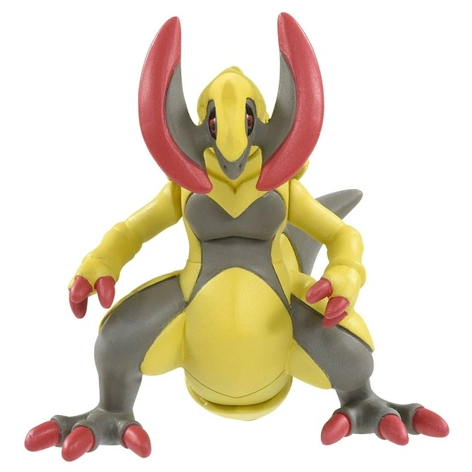  Yellow and gray Haxorus Pokémon toy figure with red claws and head crests in a crouching pose.