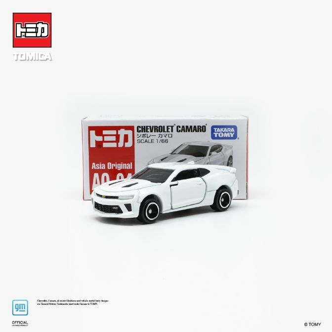 White Tomica Chevrolet Camaro 1/66 scale diecast toy car with box.