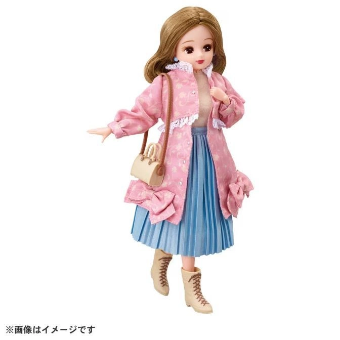  Licca doll in pink coat, blue skirt, and boots with a purse.