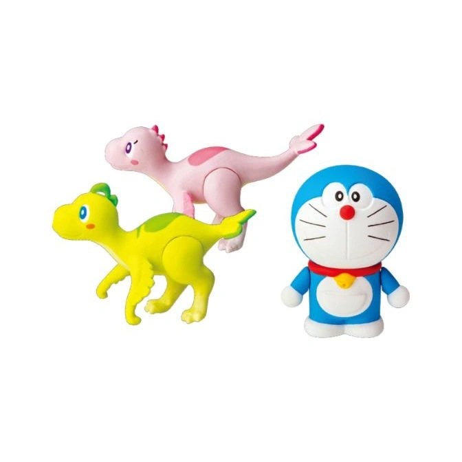 Doraemon figure with two dinosaur toys, one pink and one yellow.