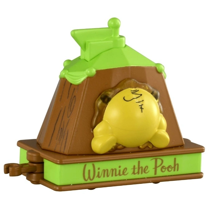  Winnie the Pooh stuck in a tree toy with green base and roof, brown tree trunk.