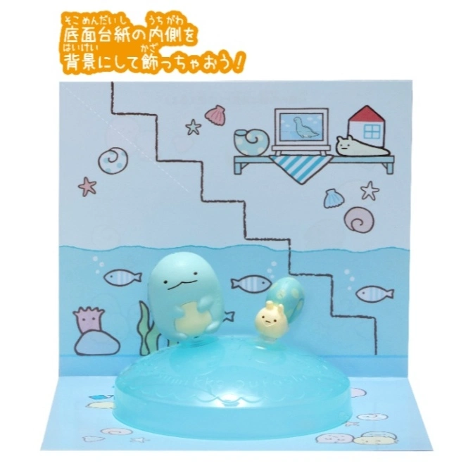  Sumikko Gurashi diorama with blue figures on a light blue base, against an ocean-themed backdrop.