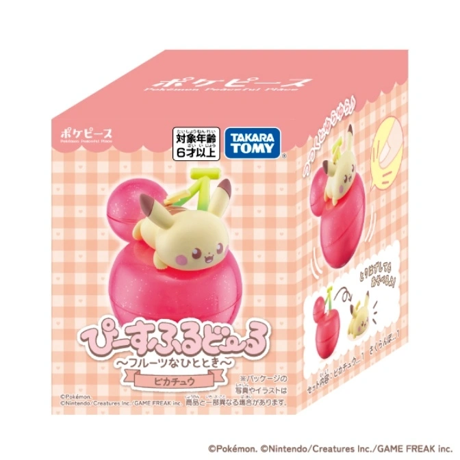  Pikachu toy on a cherry base, part of the Pokémon Peaceful Place series. Box shows it wobbling.
