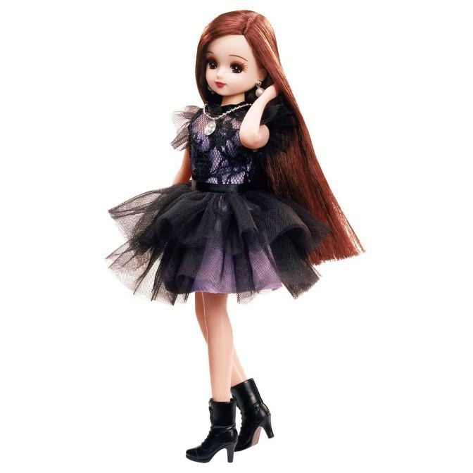  Doll with long brown hair, black dress, and heeled boots.