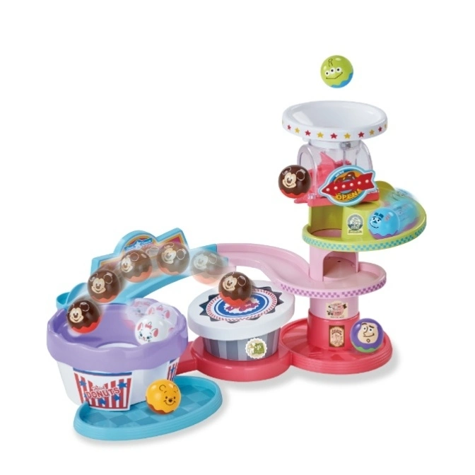 Toy playset with balls rolling down a track into a bucket. Features Disney characters and colorful design.