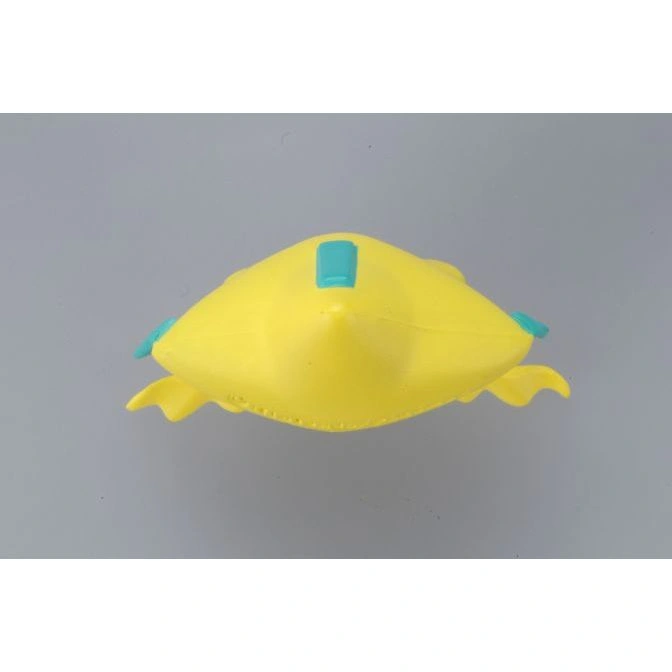  Yellow toy submarine with blue accents on a gray background.