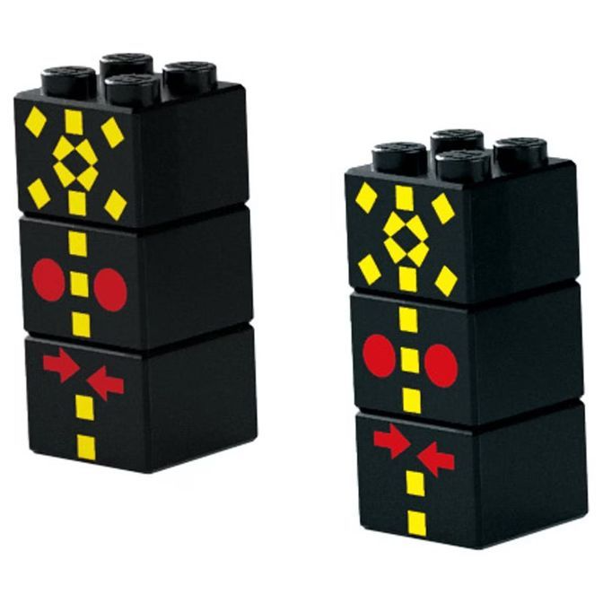 Two black toy traffic lights made of building blocks with yellow and red symbols.