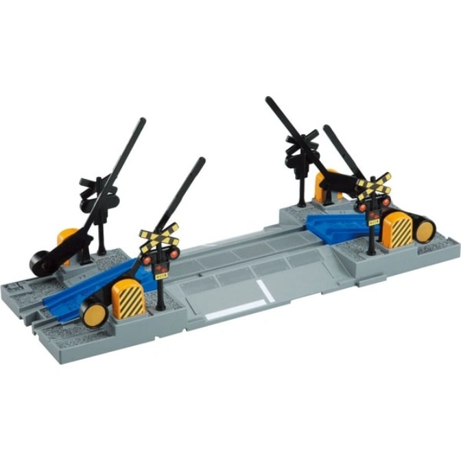 Toy train crossing with gates up, lights, and gray track.