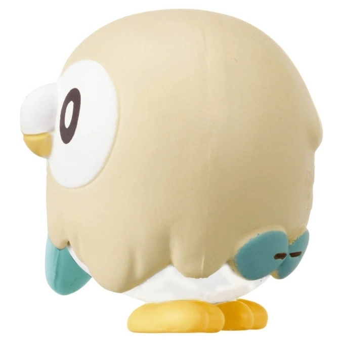  Rowlet Pokémon toy figure with yellow feet, teal wings, and a tan body.