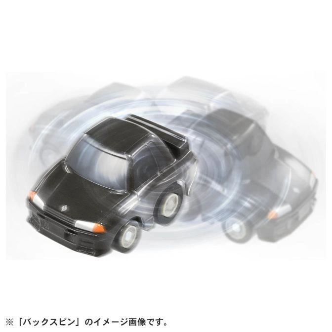  Black toy car in motion, showing a spinning effect.