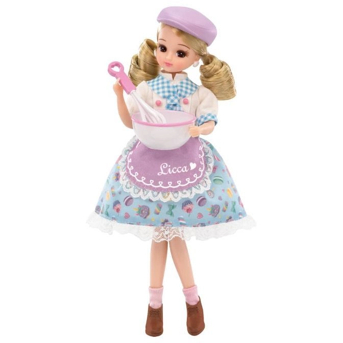  Licca doll in baking outfit holding bowl and whisk, wearing beret, apron, socks, and shoes.
