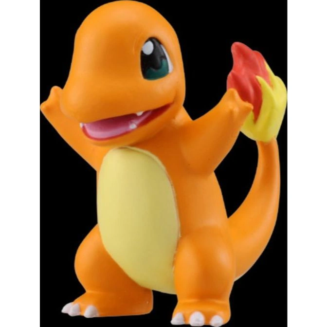 Orange Charmander toy with flame on tail, arms raised.