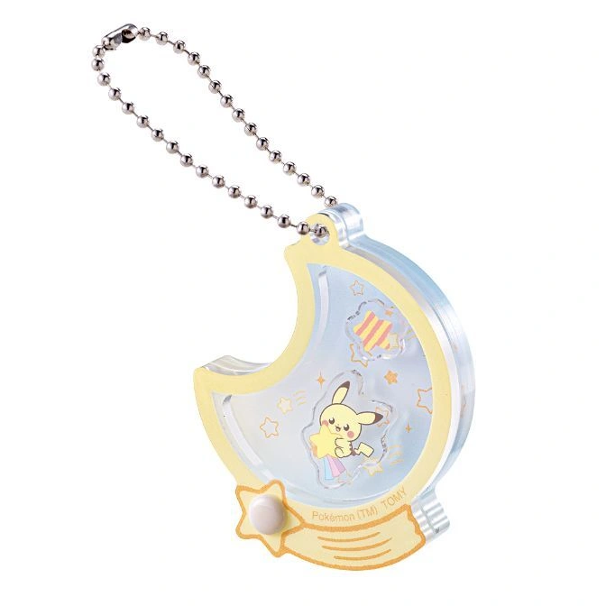 Pikachu moon keychain with ball chain. Pikachu holds a star inside a crescent moon.
