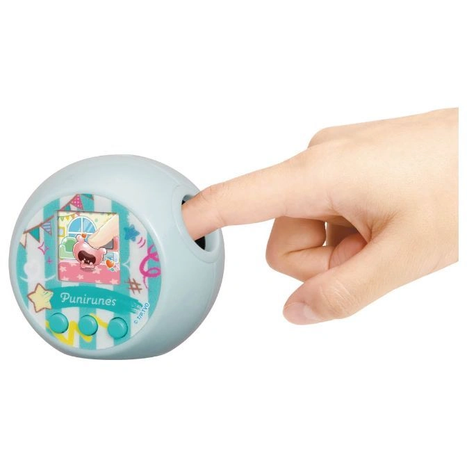  Punirunes toy with a finger pressing into the top, showing a character on screen.
