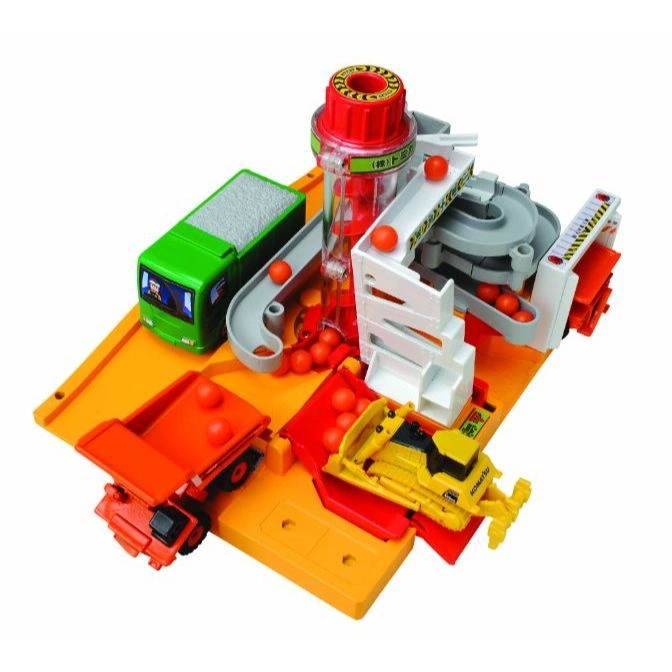  Toy construction playset with vehicles, orange balls, and a tower.