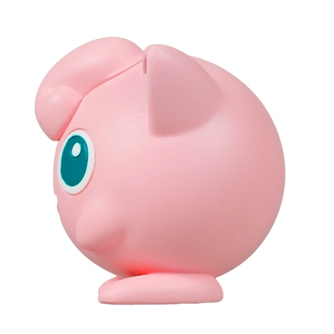  Pink Jigglypuff toy with big teal eyes and round body.