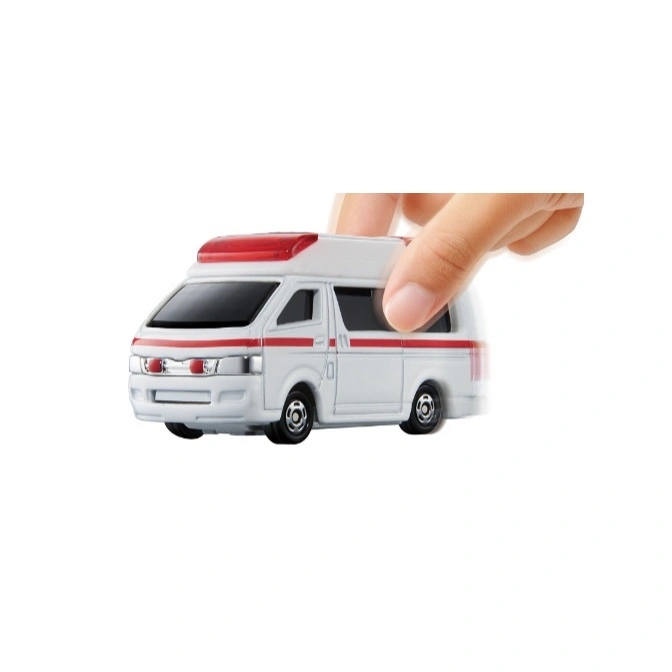 Toy ambulance with red stripe and light bar, being pushed by a hand.
