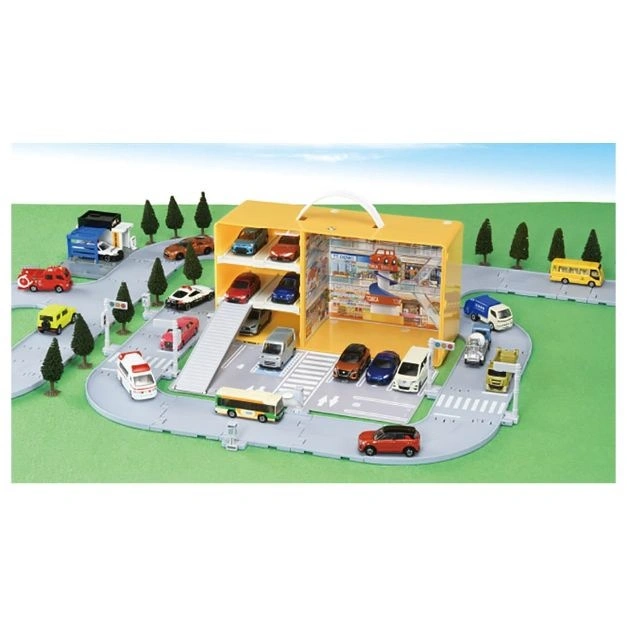 Toy car playset with cars, roads, trees, and a yellow garage-style carrying case.