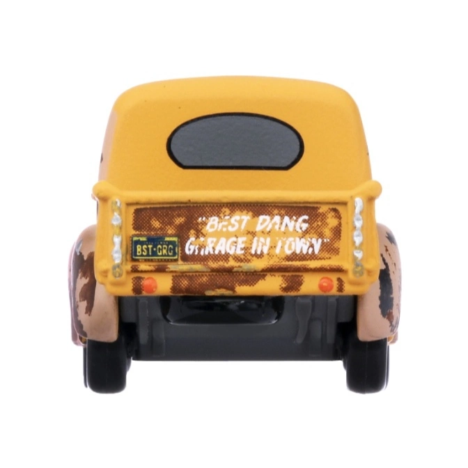  Yellow toy truck with "Best Dang Garage in Town" on the back and a license plate that reads "BST-GRG".