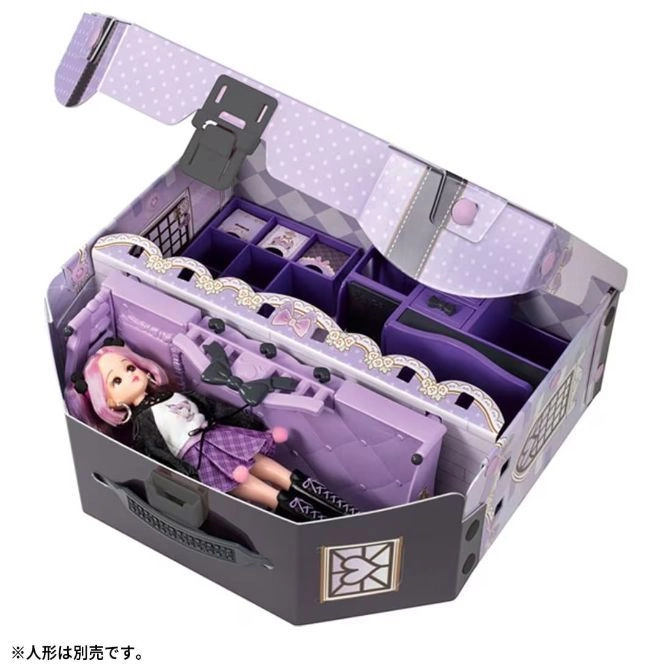  Doll in a purple playset suitcase with accessories. Open lid, polka dots, and a handle.