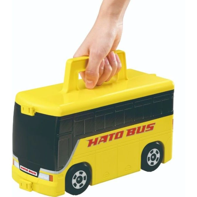  Yellow Hato Bus toy with handle being held.