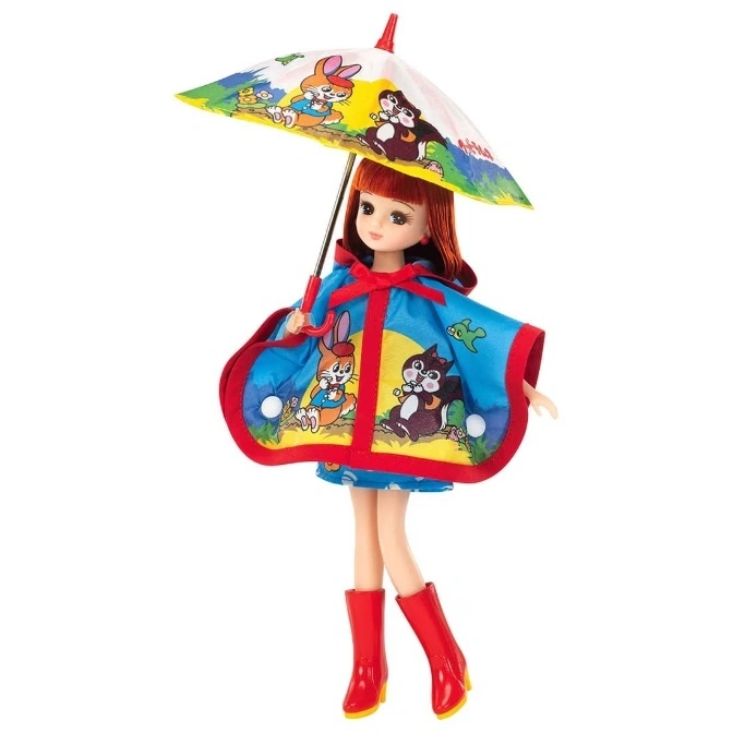 Doll in raincoat and boots holding an umbrella with cartoon animals.