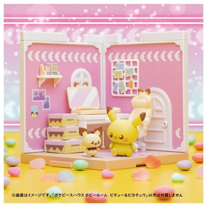  Pichu and Pikachu figures in a pink dollhouse with furniture and candy decorations.