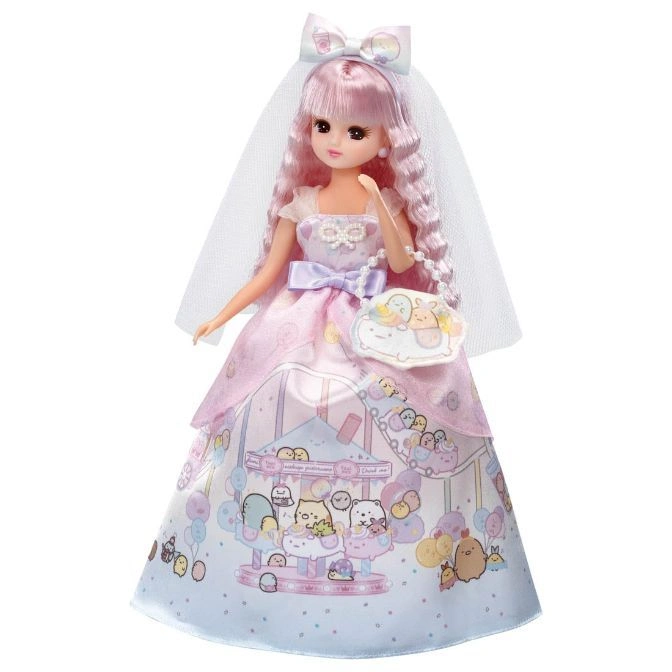 Licca doll in a pink carousel dress, veil, and purse. A charming collectible toy.