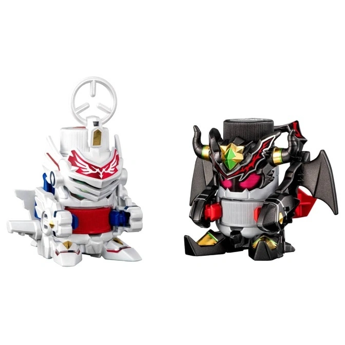 Two B-Daman toys: a white one with red accents and a black one with bat wings and horns.