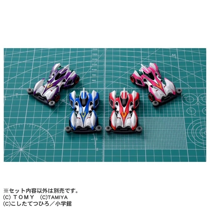  Four Mini 4WD cars in purple, pink, blue, and red on a green cutting mat.