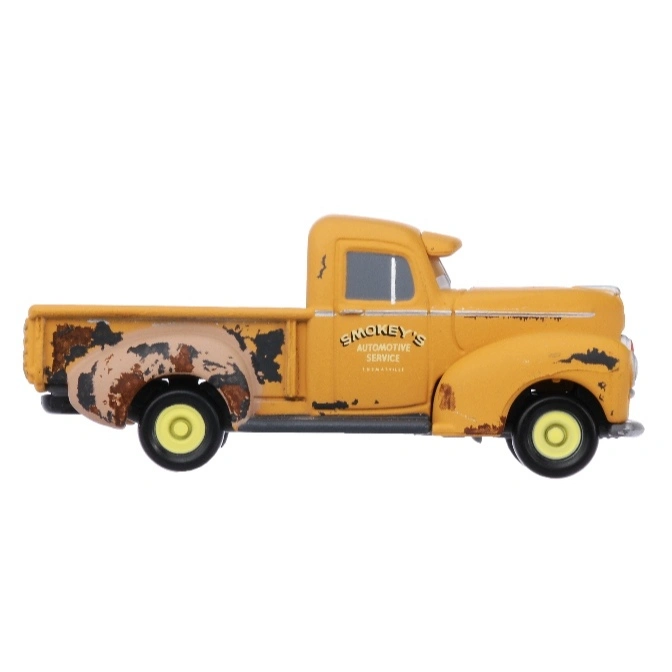  Yellow Smokey's Automotive Service toy truck with rust details.